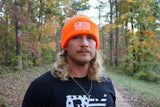 Close up of Adam wearing the Blaze Orange Sport Beanie
